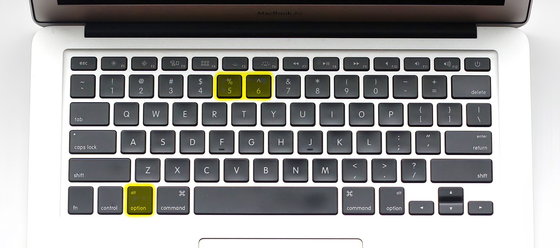 Mac Tastatur mit Alt-Taste und den Ziffern 5 und 6 für eckige Klammern markiert