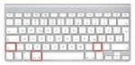 Mac keyboard with marked keys Shift, Command and Period